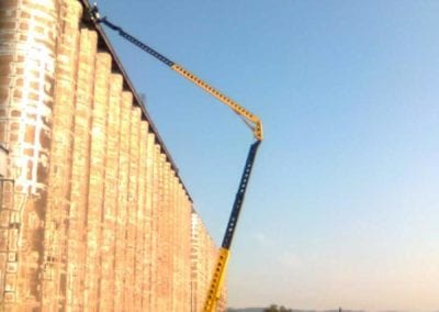 commercial silo repair with large crane