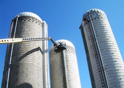 silo repair crane navigating 3 structures
