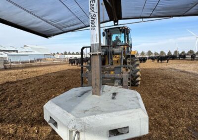 tractor working to position Easy Shade in a field